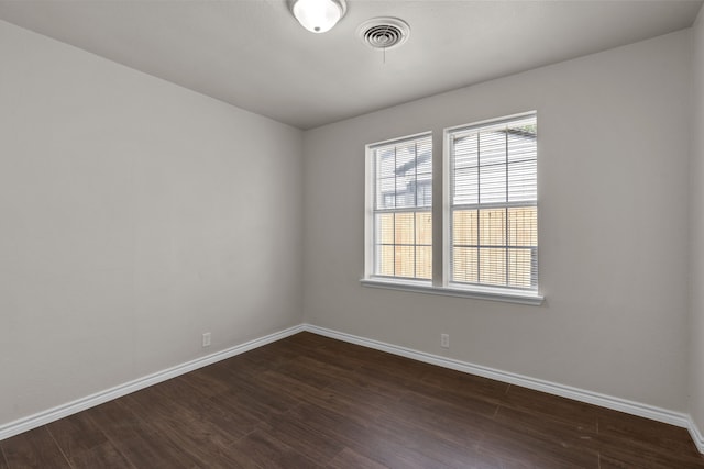 4601 Virginia Ln, Fort Worth, TX 76103 - empty room with dark wood-style flooring, baseboards, and plenty of natural light