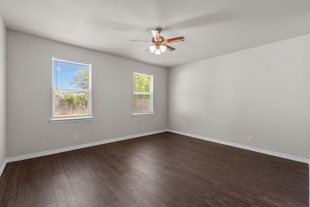 4601 Virginia Ln, Fort Worth, TX 76103 - spare room with a ceiling fan, baseboards, and dark wood-type flooring