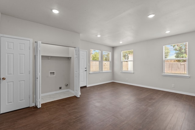 4601 Virginia Ln, Fort Worth, TX 76103 - unfurnished bedroom with dark wood-type flooring, multiple windows, recessed lighting, and baseboards