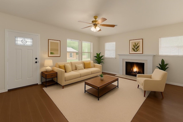 4601 Virginia Ln, Fort Worth, TX 76103 - living area with dark wood-style floors, a ceiling fan, a tiled fireplace, and baseboards