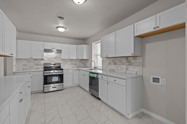 4601 Virginia Ln, Fort Worth, TX 76103 - kitchen with stainless steel appliances, under cabinet range hood, light marble finish floors, and white cabinetry