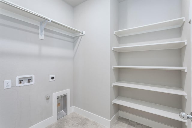 1916 Pelham Dr, Aubrey, TX 76227 - laundry area with electric dryer hookup, washer hookup, hookup for a gas dryer, baseboards, and tile patterned floors