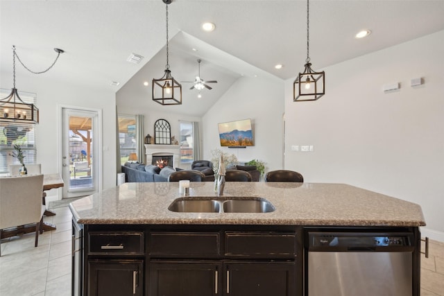 4600 Periwinkle Dr, Mansfield, TX 76063 - kitchen featuring dishwasher, a sink, lofted ceiling, light stone counters, and light tile patterned floors