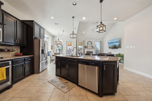 4600 Periwinkle Dr, Mansfield, TX 76063 - kitchen featuring appliances with stainless steel finishes, a sink, decorative backsplash, recessed lighting, and pendant lighting
