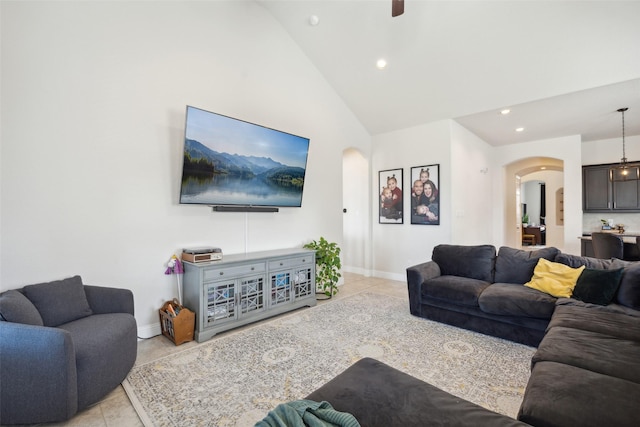 4600 Periwinkle Dr, Mansfield, TX 76063 - living room featuring arched walkways, light tile patterned flooring, lofted ceiling, recessed lighting, and baseboards