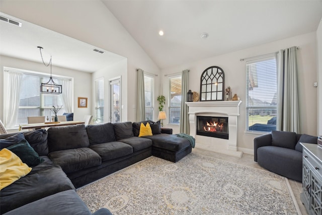 4600 Periwinkle Dr, Mansfield, TX 76063 - living room with plenty of natural light, a glass covered fireplace, lofted ceiling, recessed lighting, and light tile patterned floors