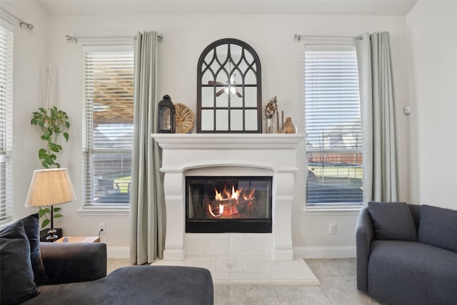 4600 Periwinkle Dr, Mansfield, TX 76063 - tiled living area with baseboards and a glass covered fireplace
