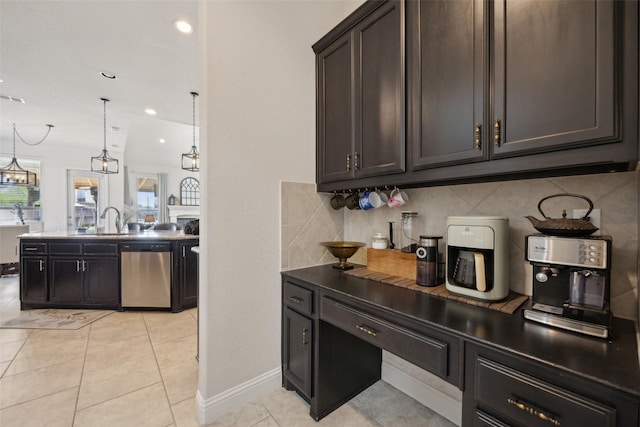 4600 Periwinkle Dr, Mansfield, TX 76063 - kitchen featuring stainless steel dishwasher, tasteful backsplash, dark brown cabinets, a sink, and light tile patterned floors