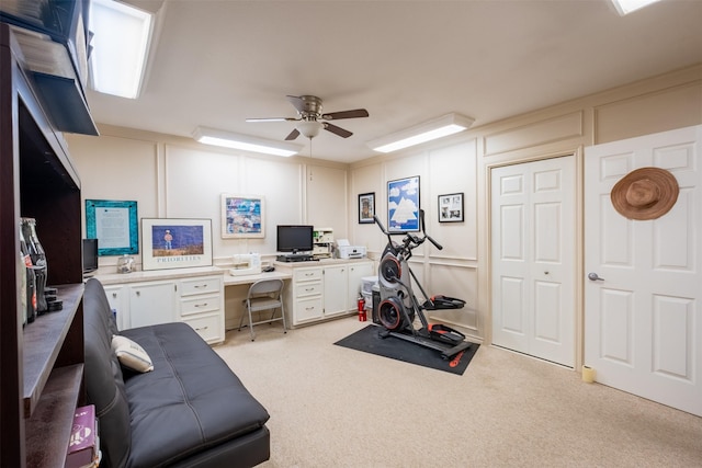 138 Hideaway Ln E, Hideaway, TX 75771 - exercise room featuring light carpet, a decorative wall, and ceiling fan