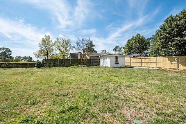 138 Hideaway Ln E, Hideaway, TX 75771 - view of yard featuring an outbuilding, a fenced backyard, and a storage unit