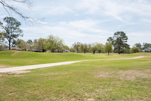 138 Hideaway Ln E, Hideaway, TX 75771 - view of community with a yard and view of golf course