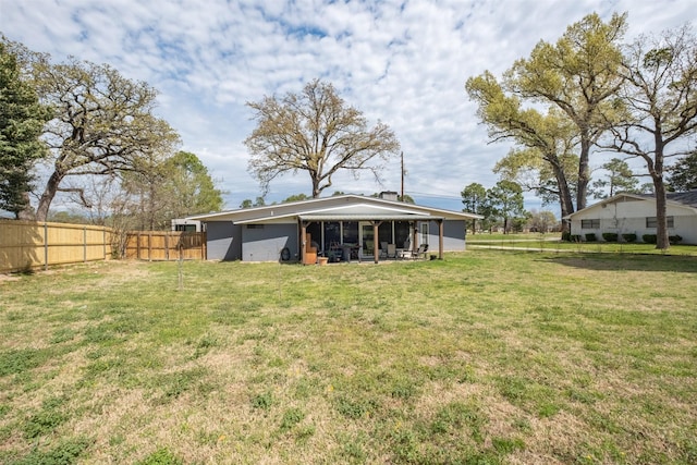 138 Hideaway Ln E, Hideaway, TX 75771 - rear view of house with a yard and fence