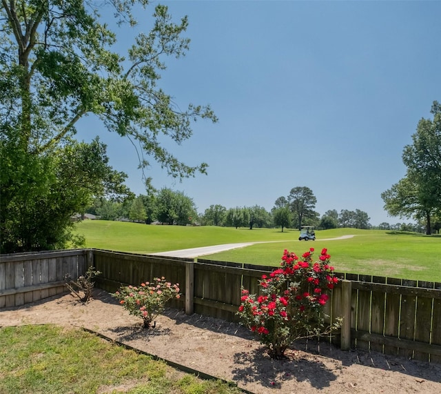138 Hideaway Ln E, Hideaway, TX 75771 - view of yard with golf course view and a fenced backyard