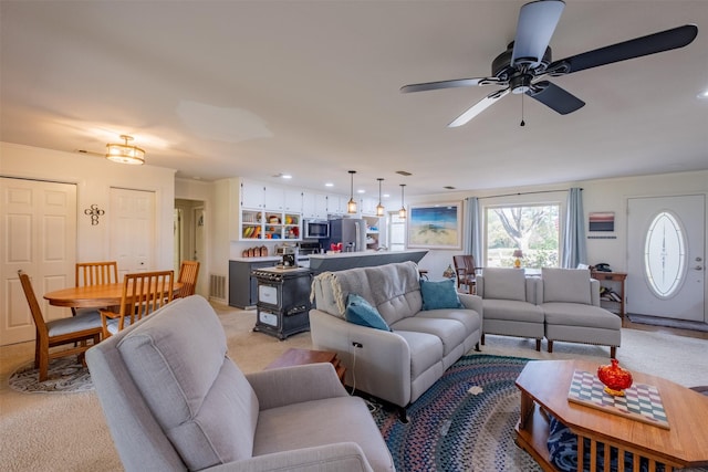 138 Hideaway Ln E, Hideaway, TX 75771 - living area with light colored carpet and ceiling fan