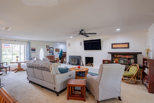 138 Hideaway Ln E, Hideaway, TX 75771 - living area featuring light colored carpet, visible vents, ceiling fan, and a brick fireplace
