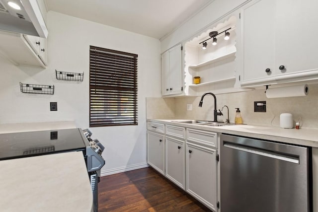 kitchen featuring light countertops, under cabinet range hood, stainless steel dishwasher, a sink, and dark wood-style floors