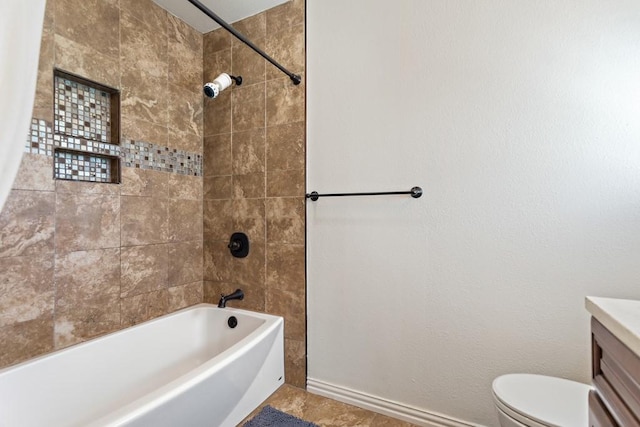 full bathroom with toilet, vanity,  shower combination, and baseboards