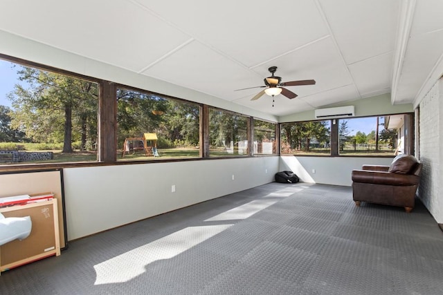 unfurnished sunroom featuring carpet floors, vaulted ceiling, an AC wall unit, and a ceiling fan