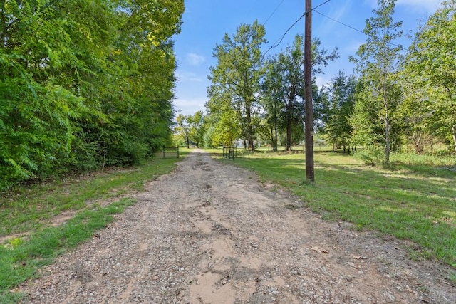 view of road with a gated entry