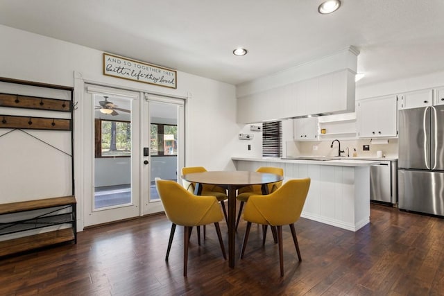 dining space featuring dark wood-style flooring, french doors, and recessed lighting