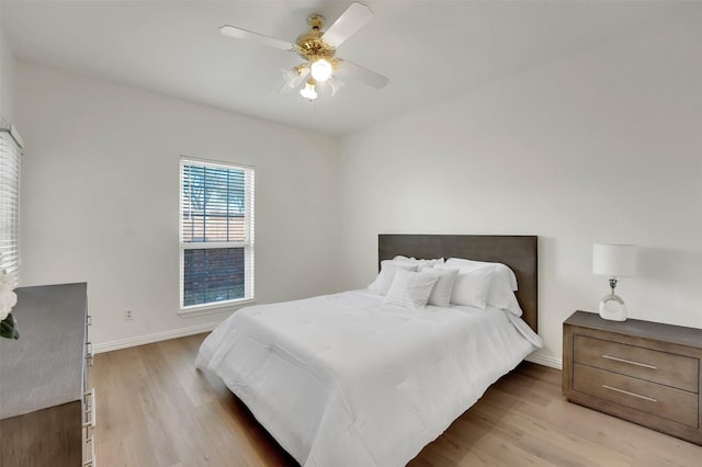 1700 Amelia Ct Unit 312, Plano, TX 75075 - bedroom featuring light wood-style floors, baseboards, and a ceiling fan