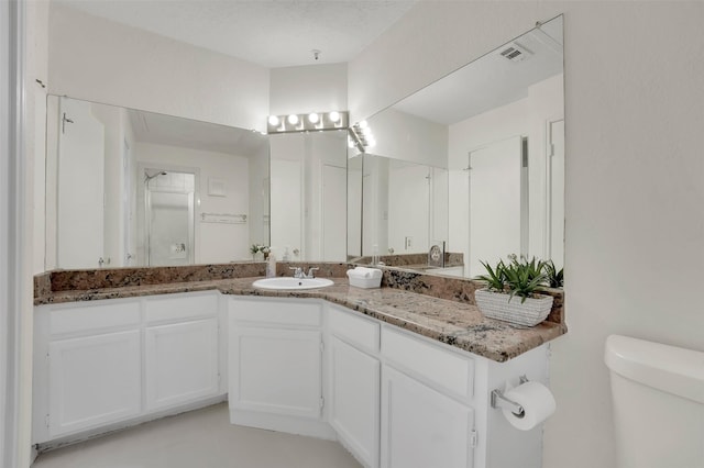 1700 Amelia Ct Unit 312, Plano, TX 75075 - bathroom featuring toilet and vanity