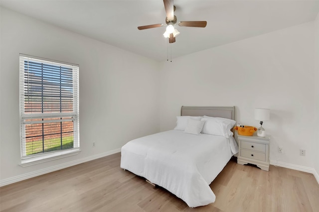 1700 Amelia Ct Unit 312, Plano, TX 75075 - bedroom with light wood-style floors, baseboards, and ceiling fan