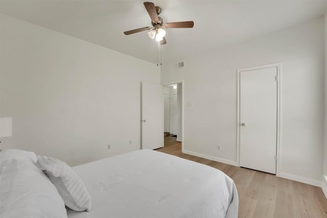 1700 Amelia Ct Unit 312, Plano, TX 75075 - bedroom with light wood-style flooring, baseboards, and ceiling fan