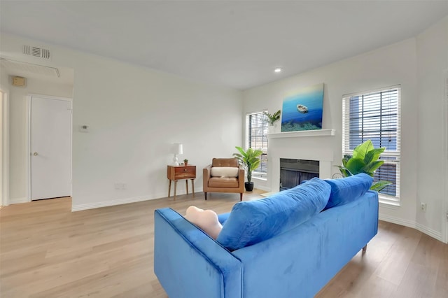 1700 Amelia Ct Unit 312, Plano, TX 75075 - living room featuring a fireplace, light wood-style flooring, baseboards, and recessed lighting