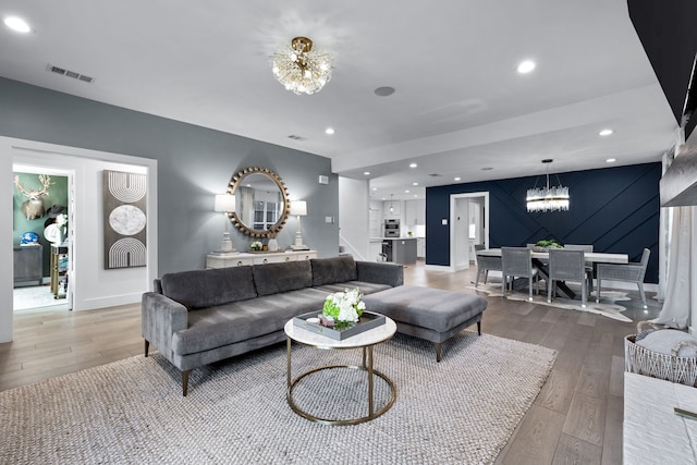 4527 Elsby Ave, Dallas, TX 75209 - living room with a chandelier, light wood-style floors, baseboards, stairs, and recessed lighting