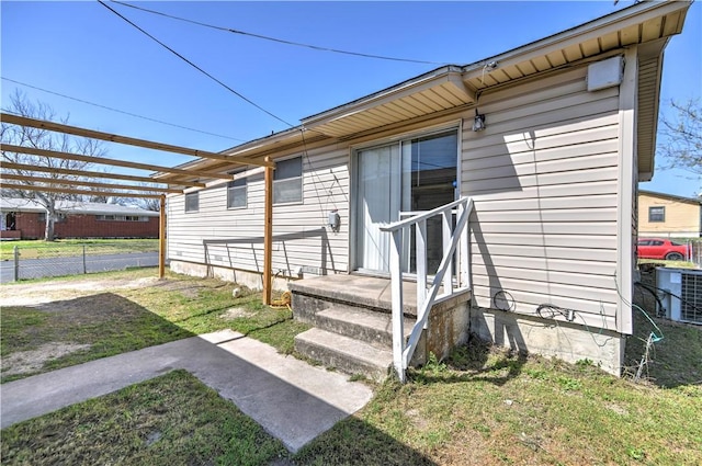 exterior space with fence and cooling unit