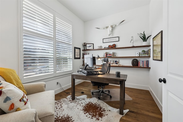 home office with baseboards and wood finished floors