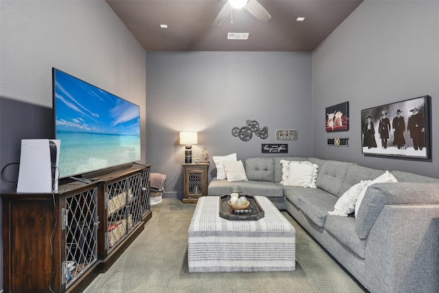 carpeted living area featuring a ceiling fan and visible vents