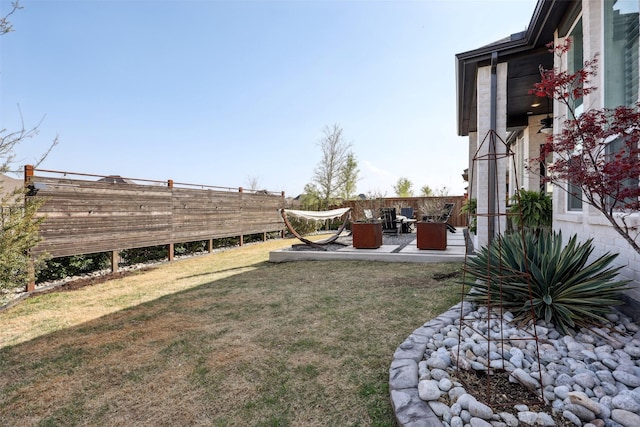 view of yard with fence and a patio area
