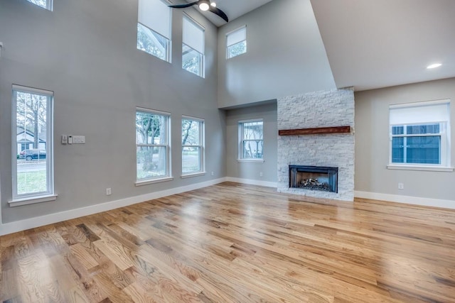 5120 Maple Springs Blvd, Dallas, TX 75235 - unfurnished living room featuring wood finished floors, a fireplace, and a high ceiling