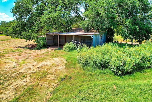 view of yard with an outbuilding and a pole building