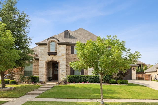 4924 Broiles Ct, Fort Worth, TX 76244 - french country style house featuring stone siding, driveway, brick siding, and a garage