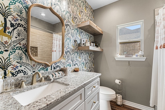 123 Oak Springs Loop, Mabank, TX 75147 - full bath with wood finished floors, toilet, vanity, baseboards, and a shower with curtain
