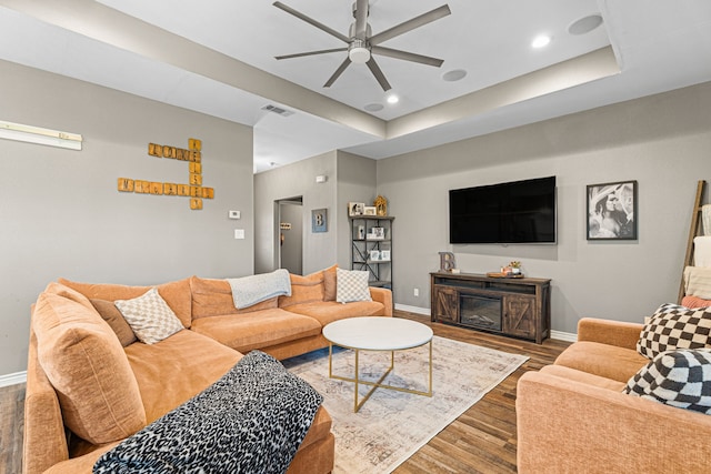 123 Oak Springs Loop, Mabank, TX 75147 - living area with ceiling fan, baseboards, wood finished floors, a tray ceiling, and recessed lighting