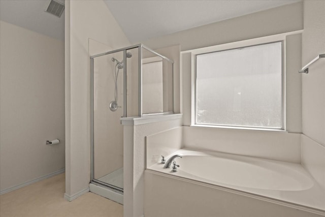 bathroom featuring a stall shower, baseboards, visible vents, and a bath