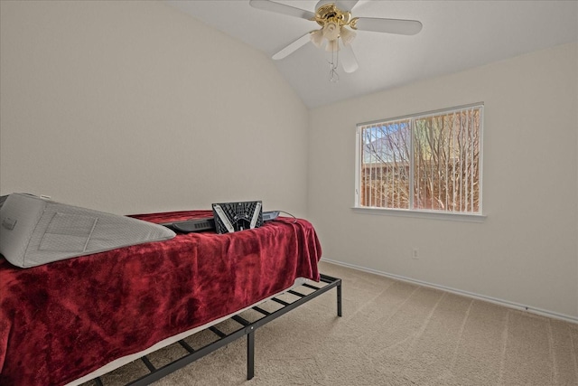 bedroom with baseboards, a ceiling fan, vaulted ceiling, and carpet