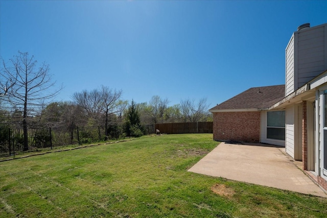view of yard with a fenced backyard and a patio area