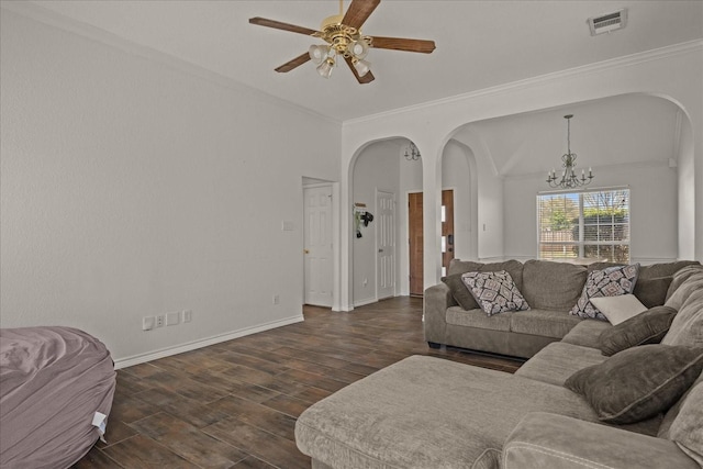 living area featuring dark wood-style flooring, arched walkways, crown molding, and visible vents
