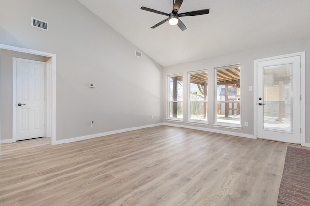 unfurnished living room with high vaulted ceiling, baseboards, a ceiling fan, and visible vents