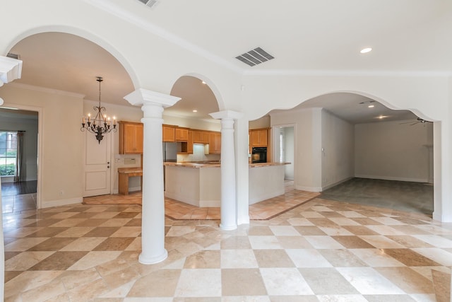 kitchen featuring visible vents, light countertops, oven, open floor plan, and ornamental molding