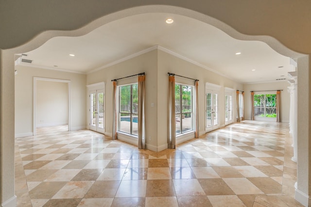 doorway with french doors, recessed lighting, ornamental molding, and baseboards