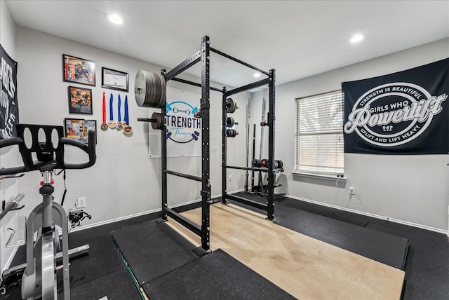 workout area with baseboards and recessed lighting
