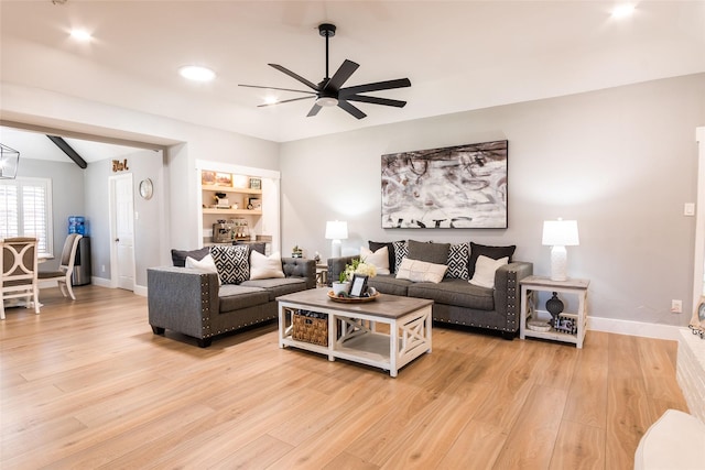 819 Meandering Way, Mesquite, TX 75150 - living area featuring ceiling fan, light wood-style floors, and baseboards