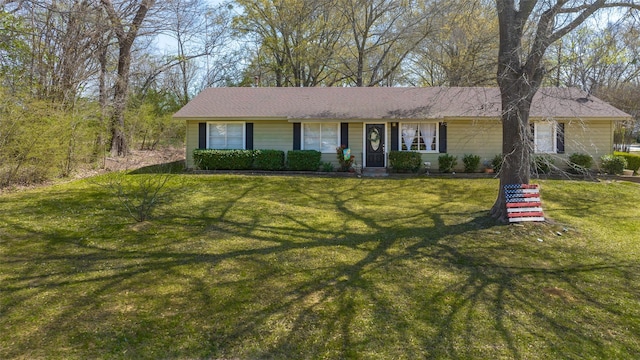 single story home featuring a front yard