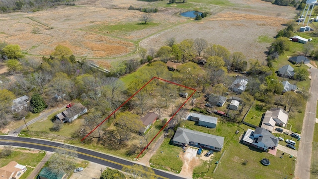 birds eye view of property featuring a rural view